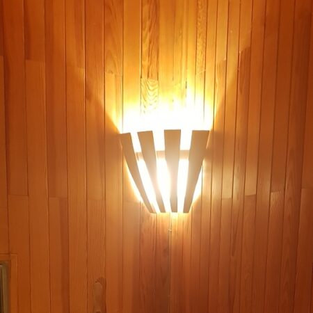 Corner wall light on paneling Corner wall light on paneling